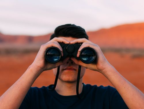 Image of man with binoculars with red desert in the background. On the 25th of November Amanda Rishworth, Shadow Minister for Youth, called for a Youth Recovery Strategy. Here’s one we prepared earlier.